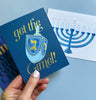 2021 Co. x Holiday Junkie get the gimel hanukkah card