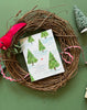 Cardinal in the forest holiday remembrance greeting card